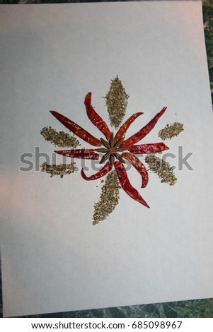 Spicy art, pictures from spices, herbs and seeds, flower ornament