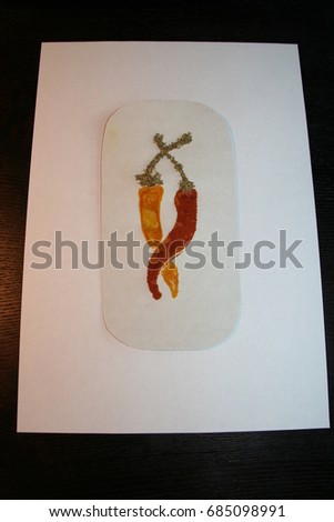 Spicy art, pictures from spices, herbs and seeds, red hot chily peppers hugs and dance