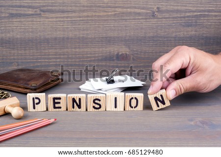 pension. Wooden letters on dark background Royalty-Free Stock Photo #685129480