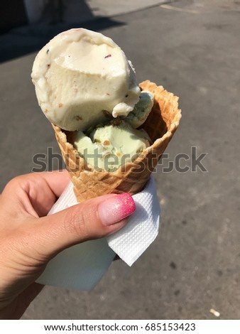 Delicious ice cream in the hand in the hot summer