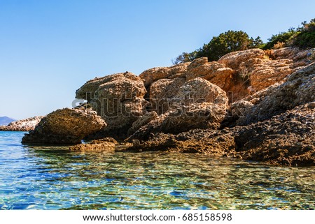Blue sea surface with waves and ripples. Beautiful views of the Mediterranean coast. Seascape,  beautiful coast, Voulisma Beach, Istron, Crete, Greece. Clear water. Bay view
