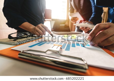 Business team meeting. Photo professional investor working new start up project. Finance task.Digital tablet docking keyboard laptop computer smart phone in morning light