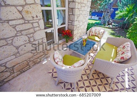 Cozy patio with armchairs