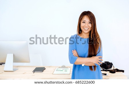 Young korean entrepreneur woman at her office smiling 