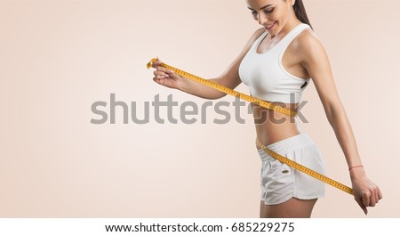 Woman and tape measure. Royalty-Free Stock Photo #685229275
