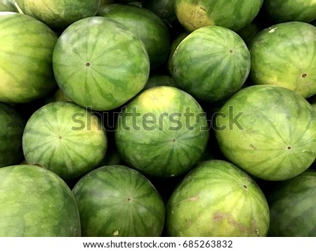 pattern background : stack of fresh watermelon in the fresh market