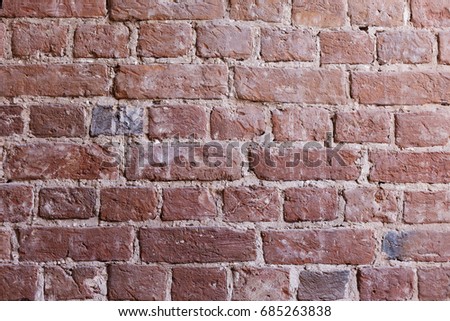 Weathered texture painted old moldings light gray and old paint white brick wall background, grungy rusty blocks of stone technology wallpaper. Design studio as a working surface.