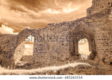 infrared camera image colored. old stone castle ruins in Koknese, Latvia