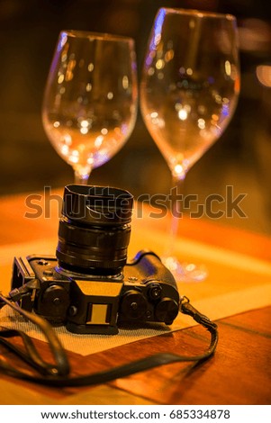 Camera on wooden table in restaurant
