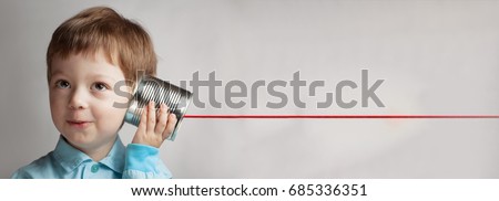 happy boy play in the tin can phone Royalty-Free Stock Photo #685336351