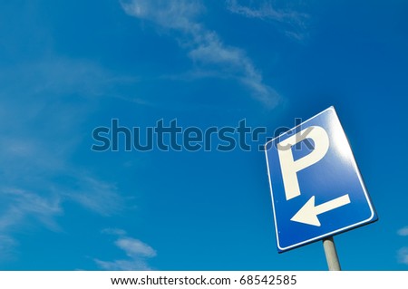 Parking signal over a blue sky
