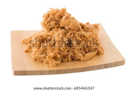 Dried shredded pork In a wooden tray isolated on white background. Royalty-Free Stock Photo #685466347