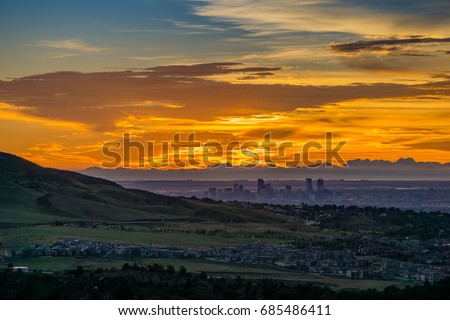 A stunning sunrise over Denver, as seen from Red Rocks Amphitheatre in Morrison, Colorado.