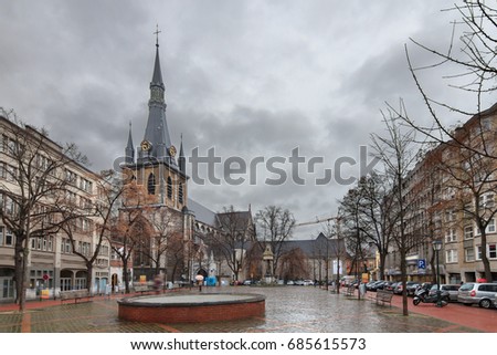 Beautiful winter cityscape of Liege, Belgium, with the St. Paul's Cathedral on a ominous cloudy day