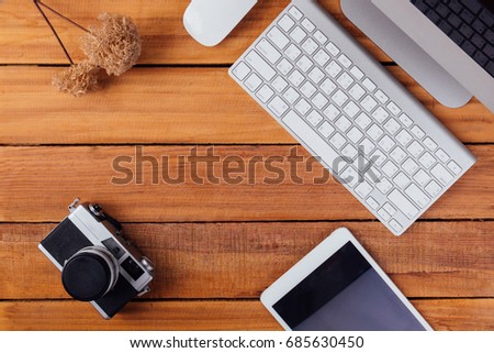 Creative flat lay photo of office workspace desk with tablet on wood table