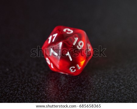 A single d20 dice showing a 1, which is a significant number in tabletop gaming