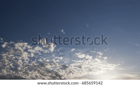   cumulus clouds that are in the blue sky. Picture with a shallow depth of field