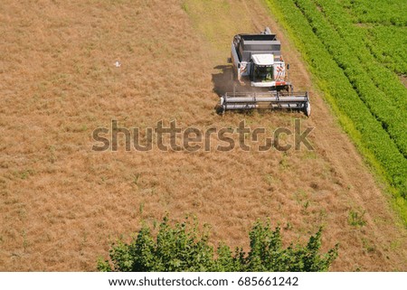 Harvester on the field cleaning