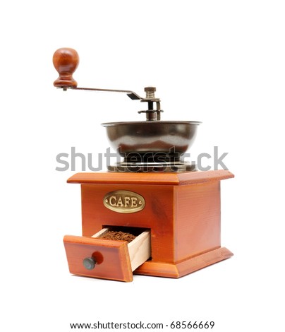 old wooden worm eaten coffee mill isolated on a white background