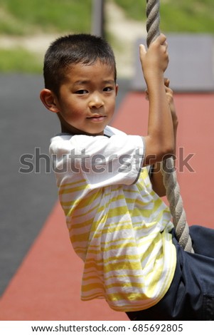 Japanese boy playing with flying fox (second grade at elementary school) Royalty-Free Stock Photo #685692805