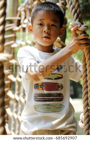 Japanese boy playing with ropewalking (second grade at elementary school) Royalty-Free Stock Photo #685692907