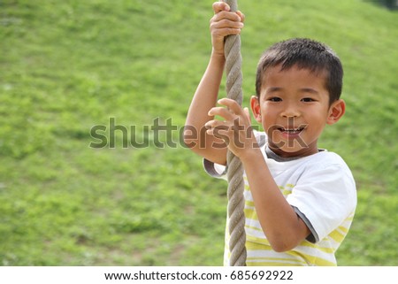 Japanese boy playing with flying fox (second grade at elementary school) Royalty-Free Stock Photo #685692922