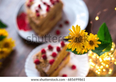 Homemade cake baking on a platter on a wooden background