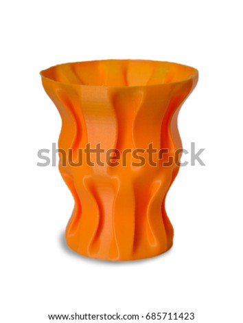 Objects printed by 3d printer Isolated on white background. Bright colorful object. Vase orange color. Automatic three dimensional performs plastic modeling. Modern 3D printing technology.