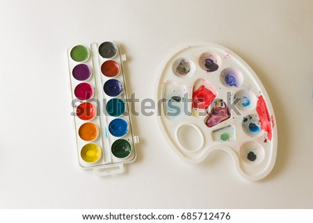Palette with watercolor paints. Art and education. Hobby. Drawing with watercolor paints.