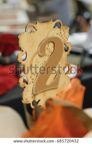 Wooden die cut table number rustic wedding decor closeup