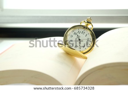 vintage watch on a book