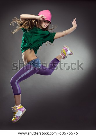 cool dancer woman on gray background