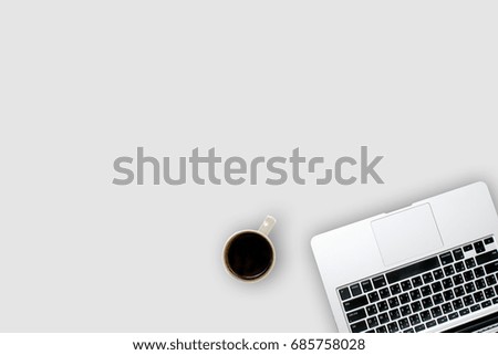Top view laptop computer with mobile phone, cup of coffee, on office desk table.Business template mock up for adding your text. Minimal style