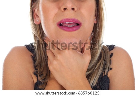 Picture of young woman having sore throat holding her neck, checking the inflamed glands - isolated background