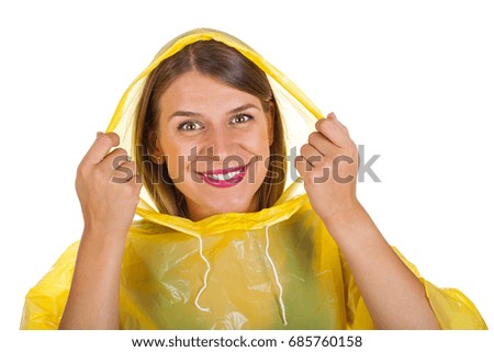 Picture of attractive caucasian woman wearing a yellow raincoat, posing on isolated background