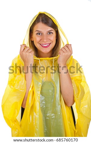 Picture of attractive caucasian woman wearing a yellow raincoat, posing on isolated background