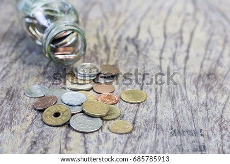 coins collection in the bottle conceptual image for financial .