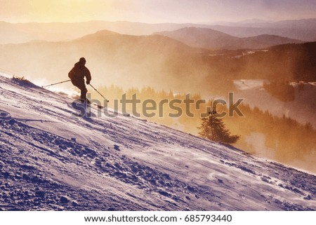 Skier and winter nature in mountains