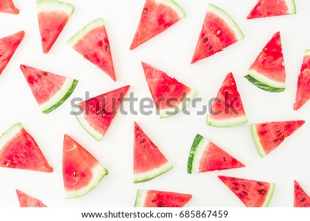 Pattern of sliced red watermelon on white background. Flat lay, top view