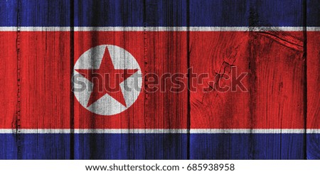 North Korea  flag painted on wooden wall for background.