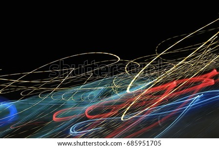 Colorful light waves. Motion blur. Abstract lighting transport with low speed shutter and dark background.