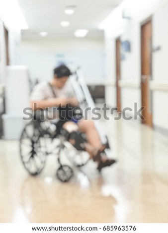 Abstract photo of hospital rehabilitation center lobby with patient in the wheel chair waiting for medical treatment