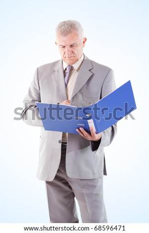 Senior Businessman looking at documents
