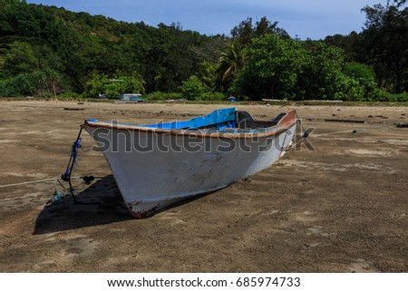 fisherman boats park on the beach with the blue sky