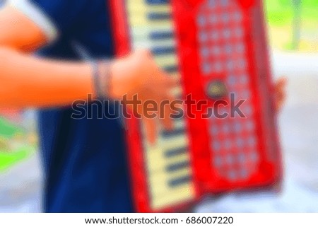  blurry image accordion player