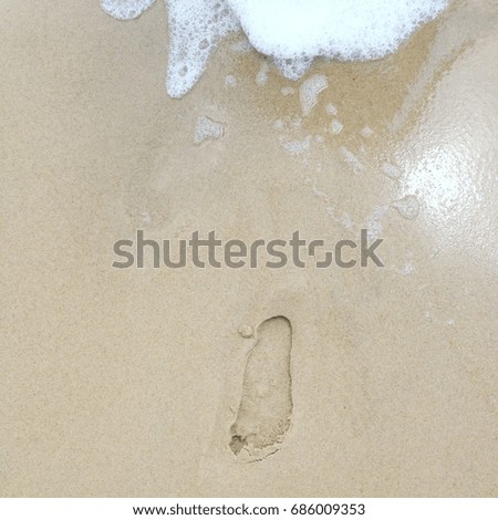 Foot step on a sand