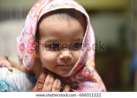 Infant baby girl after bath portrait of natural pose