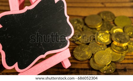 Wooden board with a coin. Business and Finance Concept.
