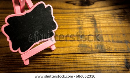 Wooden Board Isolated Over Wooden Background. Copy Space.