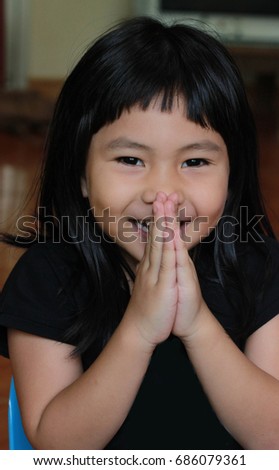 Girl praying in the morning.asian girl hand praying,Hands folded in prayer concept for faith,spirituality and religion.